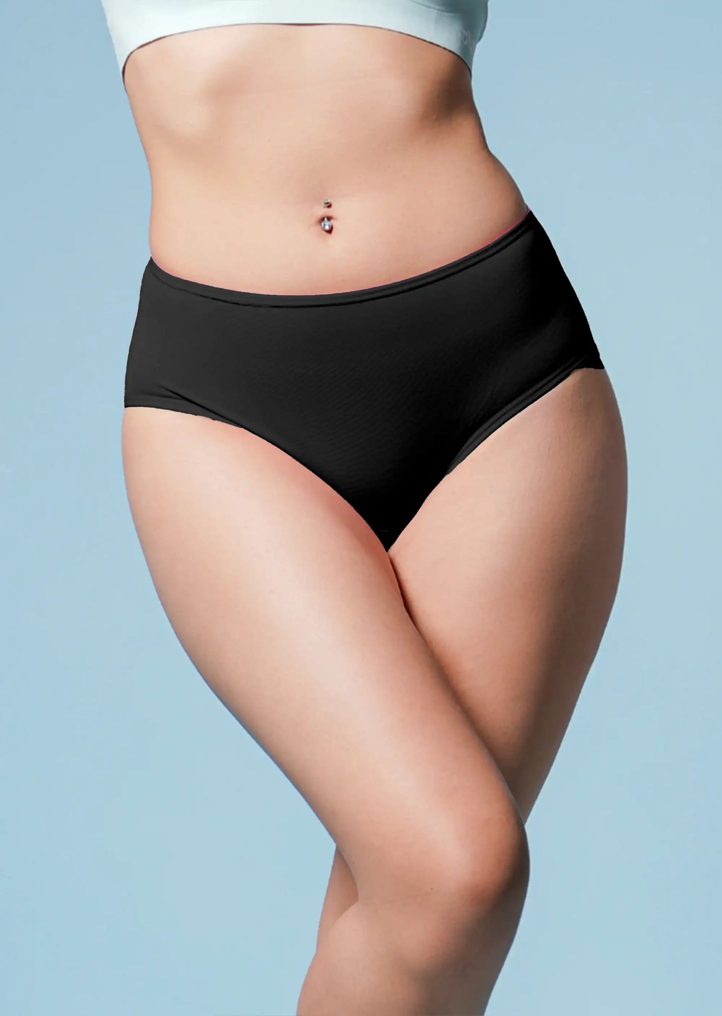 Person wearing black high-waisted underwear against a light blue background