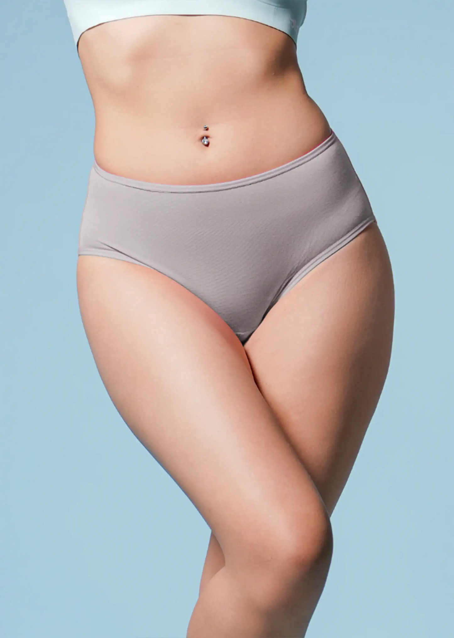 Person wearing a gray underwear against a light blue background