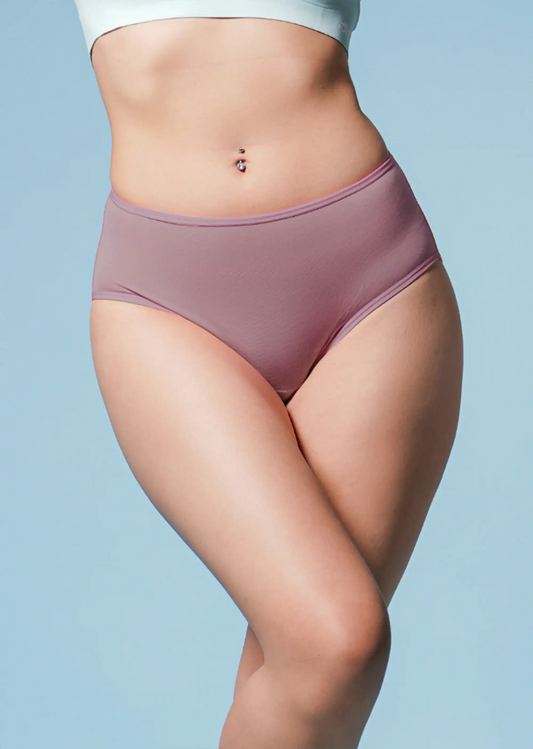 Person wearing a pair of brown underwear against a light blue background